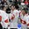 TORONTO, CANADA - JANUARY 3:  Switzerlandâ€™s Luca Hischier #13 and Switzerlandâ€™s Tim Wieser #22 celebrate after a defeating Team Germany 5-2 during relegation round action at the 2015 IIHF World Junior Championship. (Photo by Andrea Cardin/HHOF-IIHF Images)

